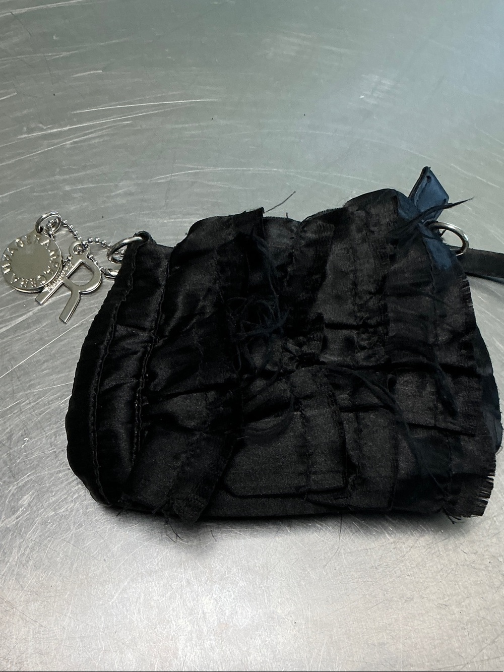Rampage ruffled black small purse.
